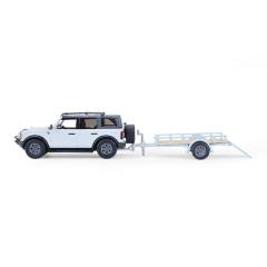 Bronco 4-Door Badlands in Cactus Grey with Utility Trailer and Motorcycle